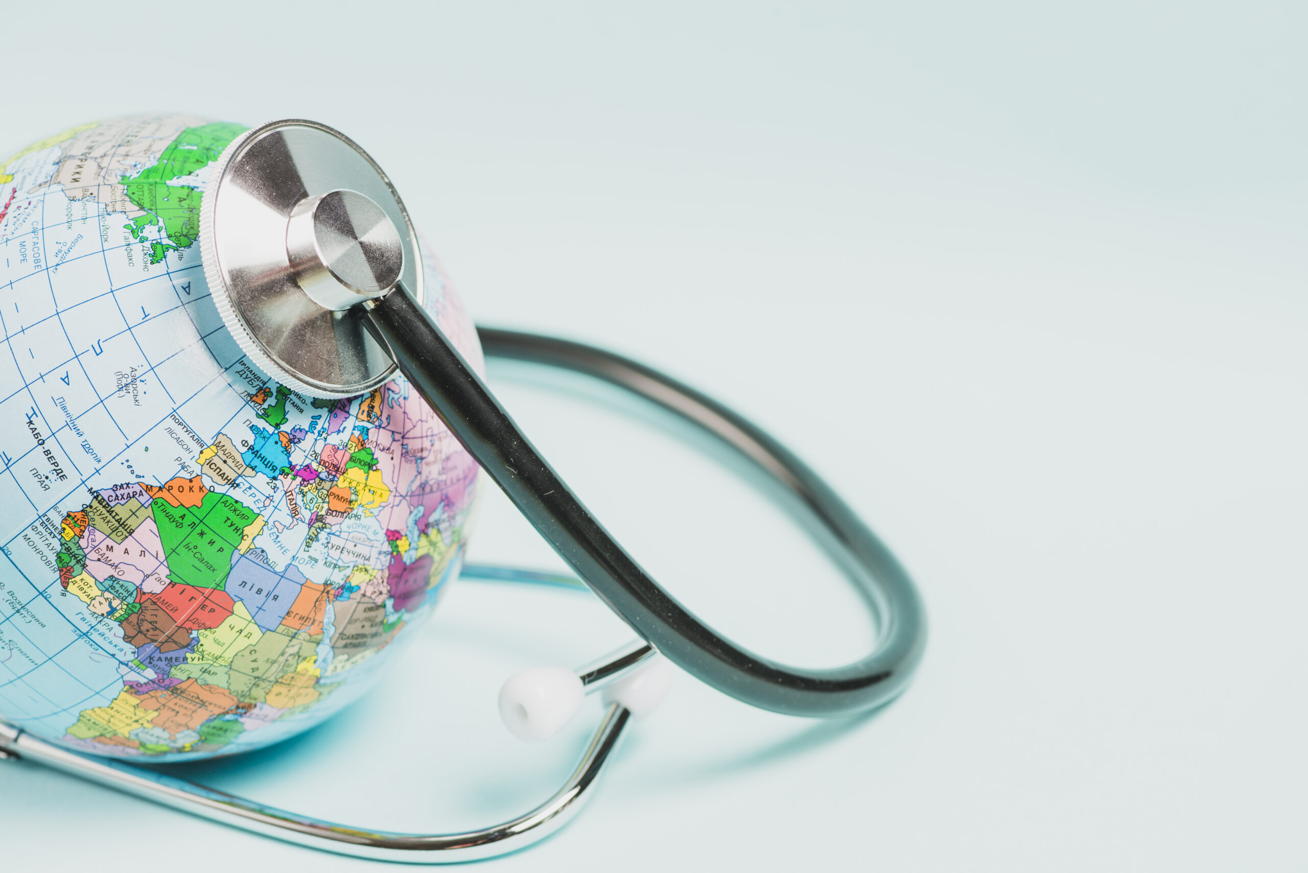 globe-care-with-stethoscope-blue-background