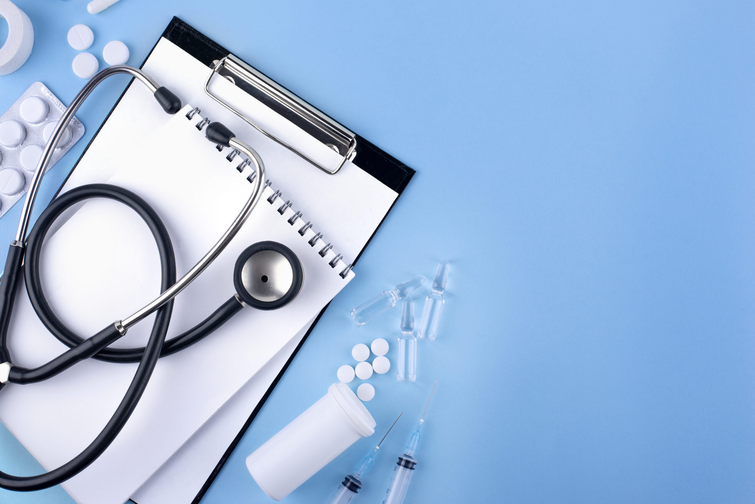 top-view-medicine-clipboard-arrangement