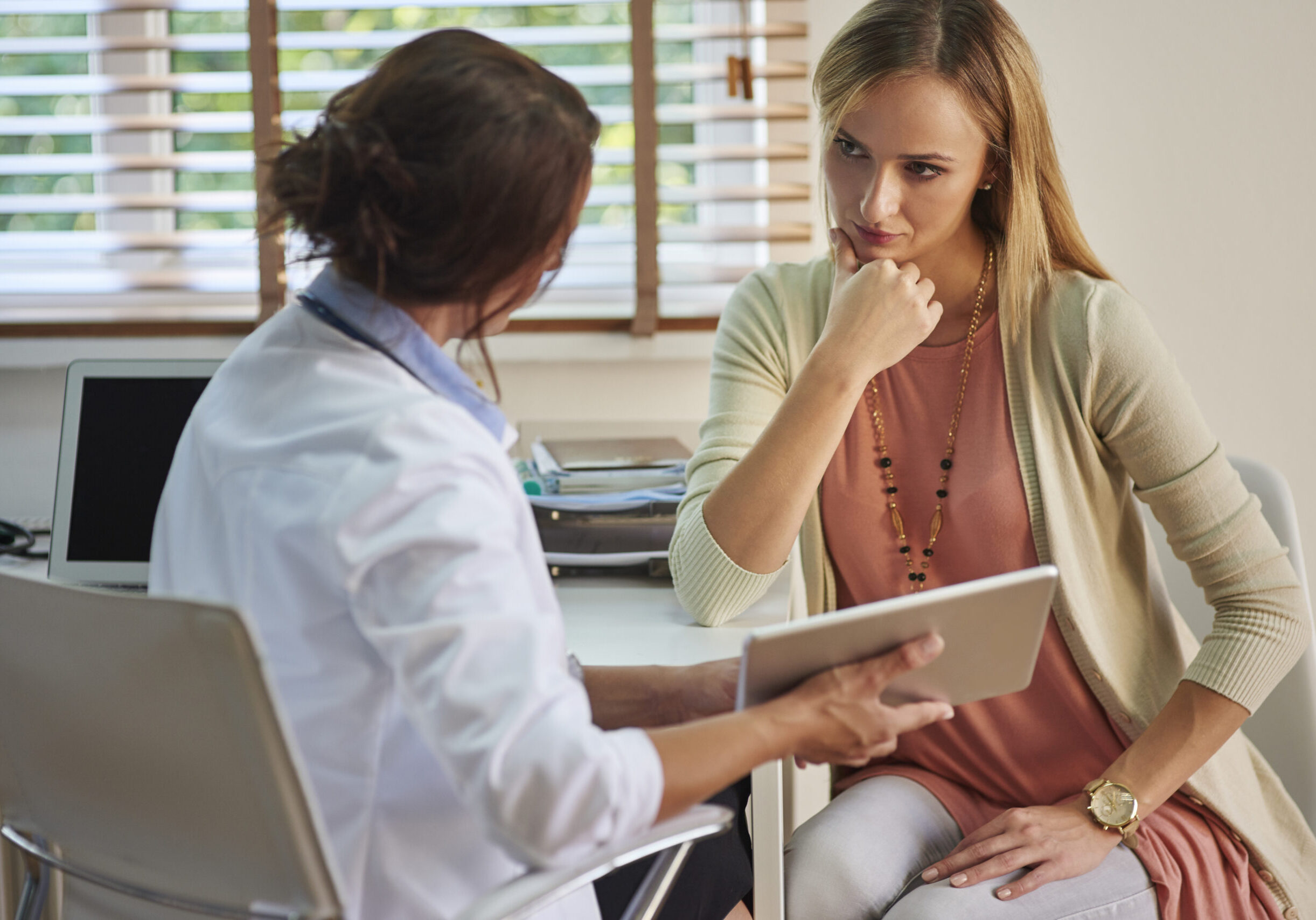 Serious woman during her visit at the doctor