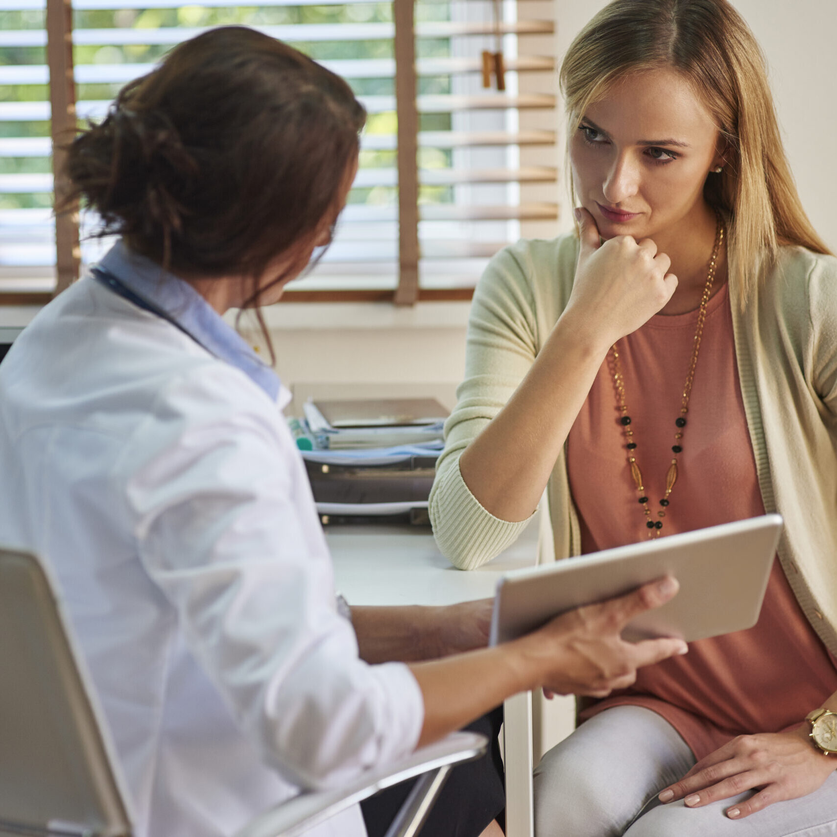 Serious woman during her visit at the doctor