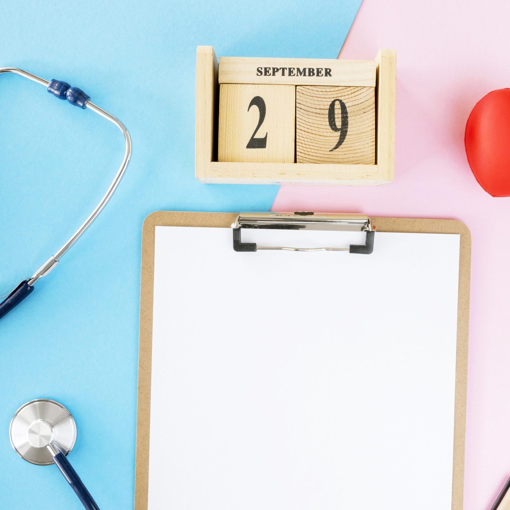 top-view-notepad-with-heart-shape-stethoscope